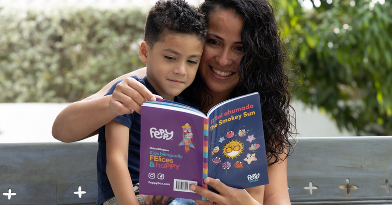 Image of a mother teaching Spanish to her child using Feepy books